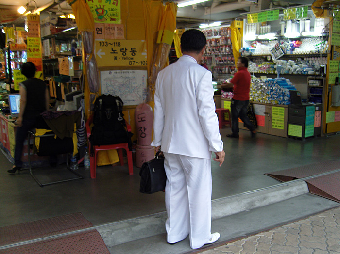 man_in_white_suit